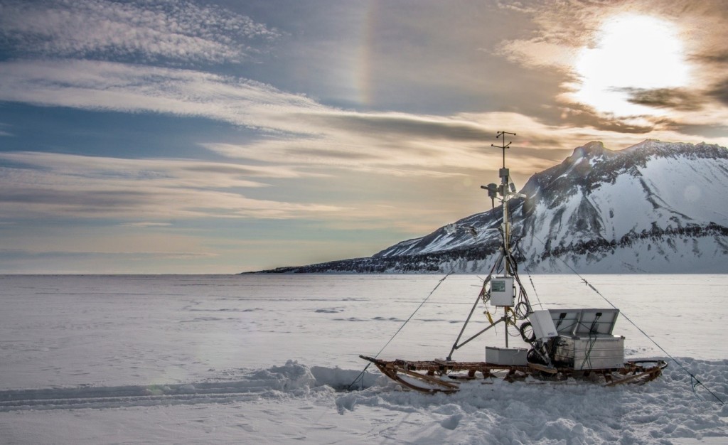 Figure 3: Our eddy covariance tower on thin ice (20cm) in the outermost region of Young Sound (NE Greenland). Photo: Jakob Sievers.