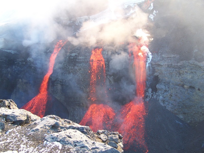 Lava meets snow: Lava flowing into a canyon at the snow covered Eyjafjallajökull during an eruption in 2010 - one of the many examples where volcanology and cryospheric sciences meet. Photo credit: Martin Hensch (Imaggeo)