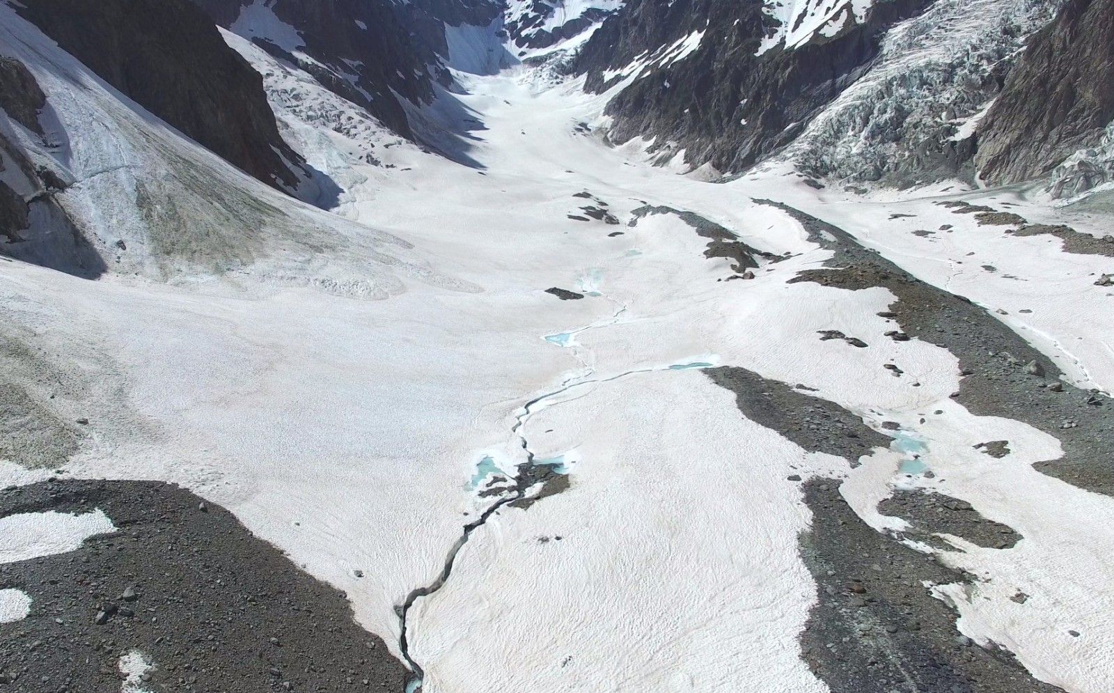 Figure 2: Up-glacier view of Miage Glacier, in which three of the glacier’s four tributaries are visible – from upper centre-left: Tête Carée Glacier, Bionnassay Glacier, Dome Glacier. 