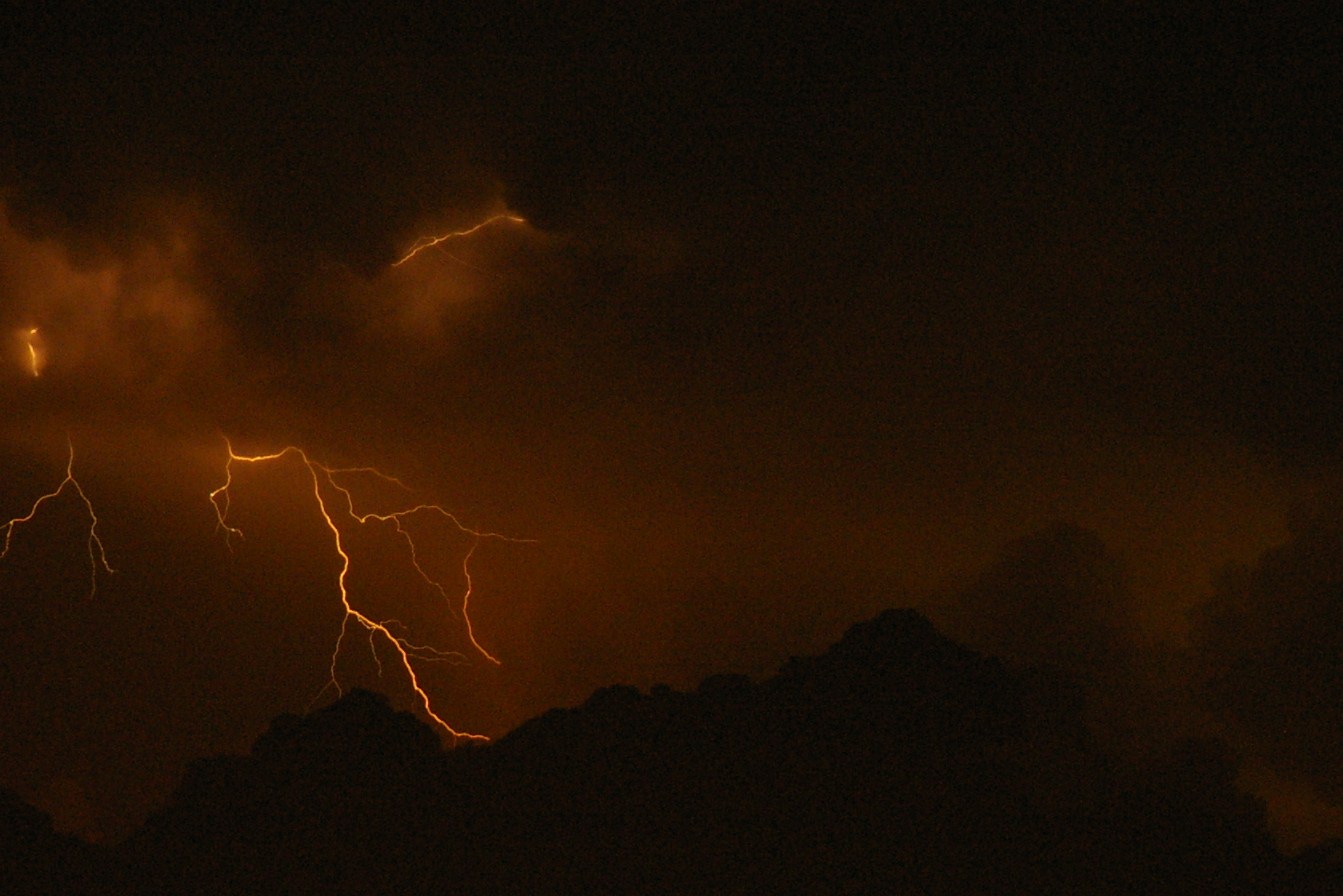 Orange lightning bolt at night