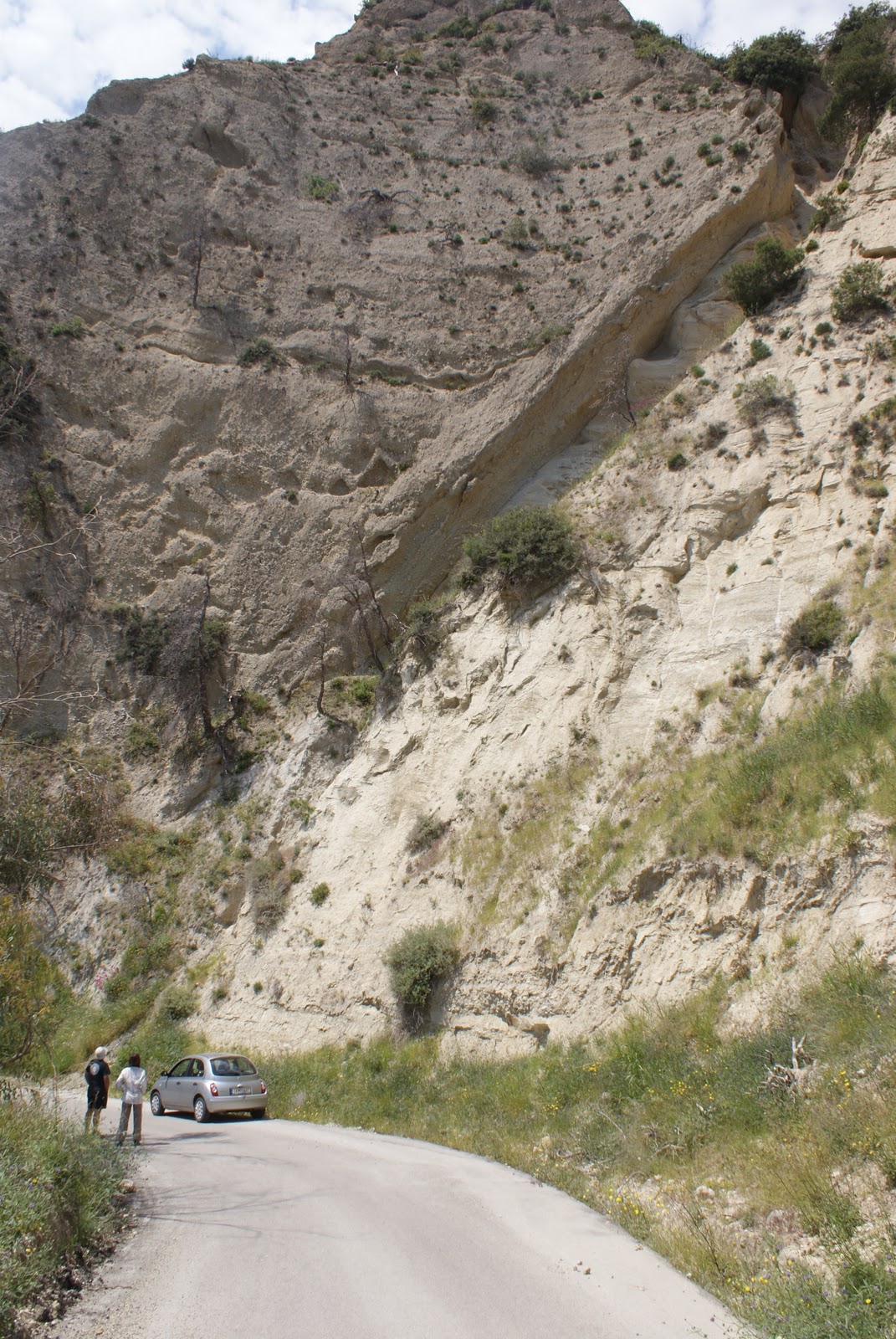 Fault in Central Greece showing highly permeability down-thrown gravel beds in the hangingwall juxtaposed against low permeability marl beds in the footwall. Juxtaposition of sediment/rock with different hydraulic properties is one of the main ways in which faults can impact sub surface fluid flow