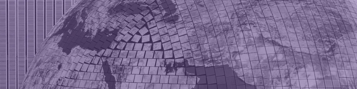 Tinted detail of a photo: Close-up of a huge globe made of many small screen tiles showing the Earth in colour, beside a walkway of visitors against a striped wall rendered in black and white.