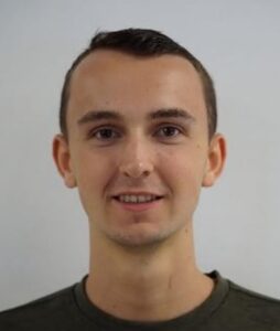 Photo of Koen smiling at the camera