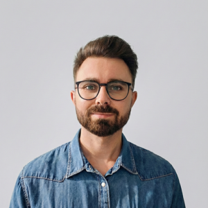 Photo of Aleksander smiling at the camera