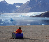 Geodesists on Tour: Circumnavigating Greenland by Helicopter