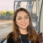 Headshot of Kiana smiling directly at the camera