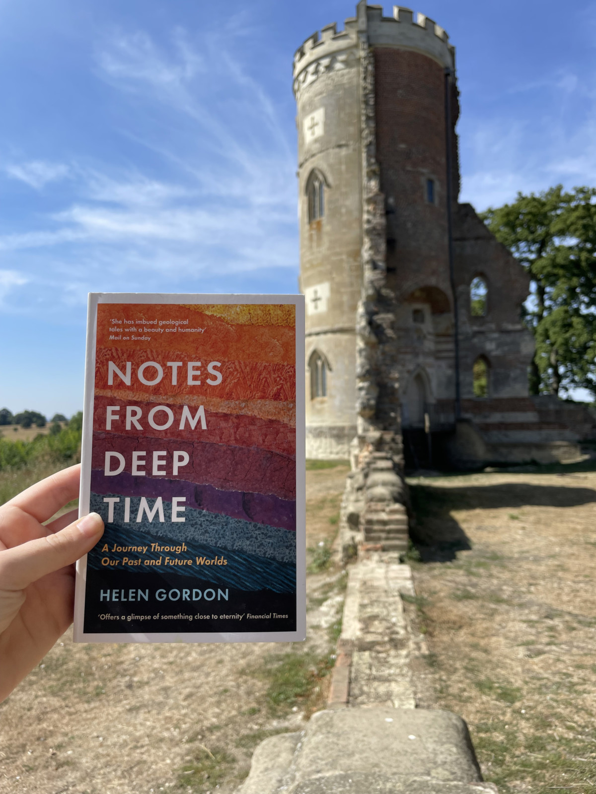 The cover of the book 'Notes From Deep Time' by Helen Gordon, with the folly where I read the book in the background.