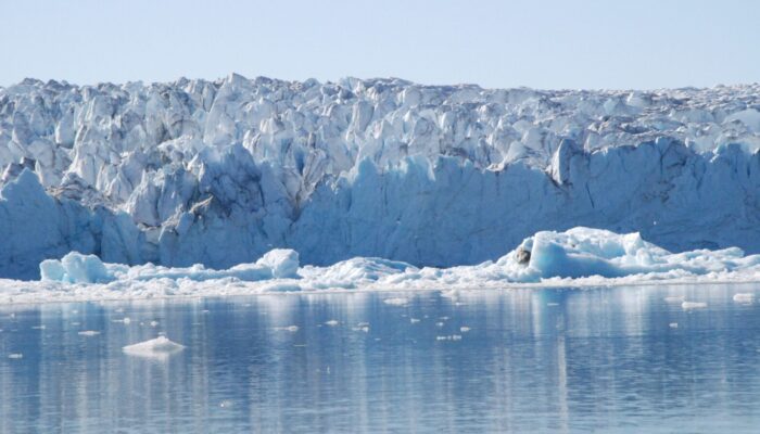 Melting Glaciers Move Lithospheric Plates and Fluctuate Mid-ocean Ridges’ Spreading