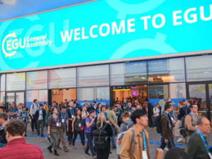 Decorative Image: The entrance to the EGU General Assembly from a previous year. A banner over the entrance doorways reads "Welcome to EGU". 