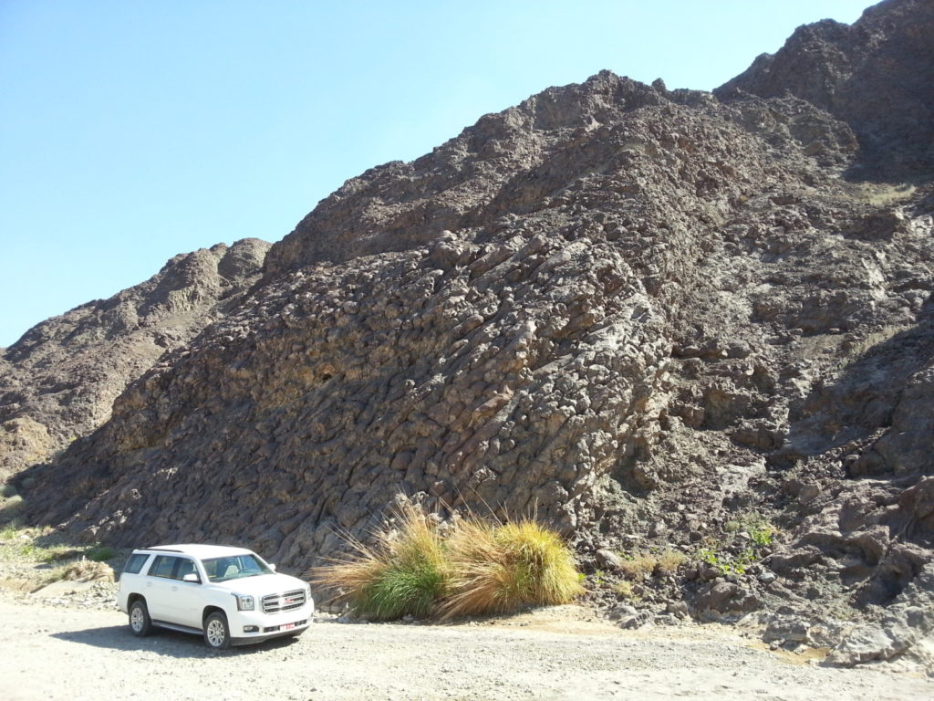 Pillow basalts at Wadi Jizz, which is part of the Semail Ophiolite sequence. These were named the Geotimes Pillow Lavas after a photo of them was published on the cover of the Geotimes magazine in 1975.