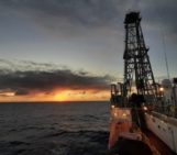 Photo of sunset behind the drilling vessel JOIDES resolution