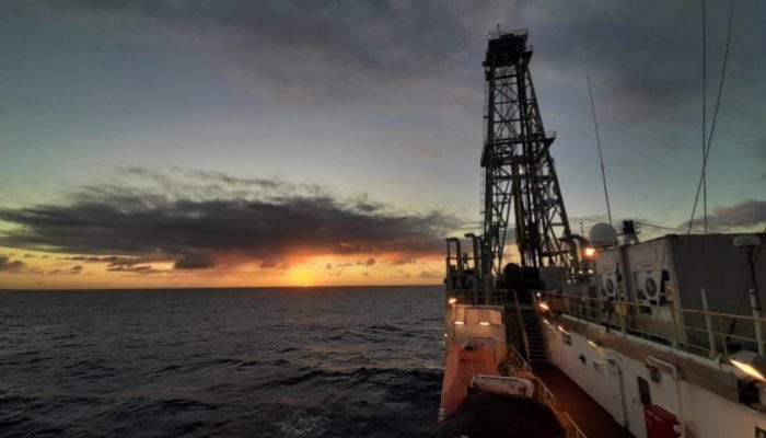 Photo of sunset behind the drilling vessel JOIDES resolution