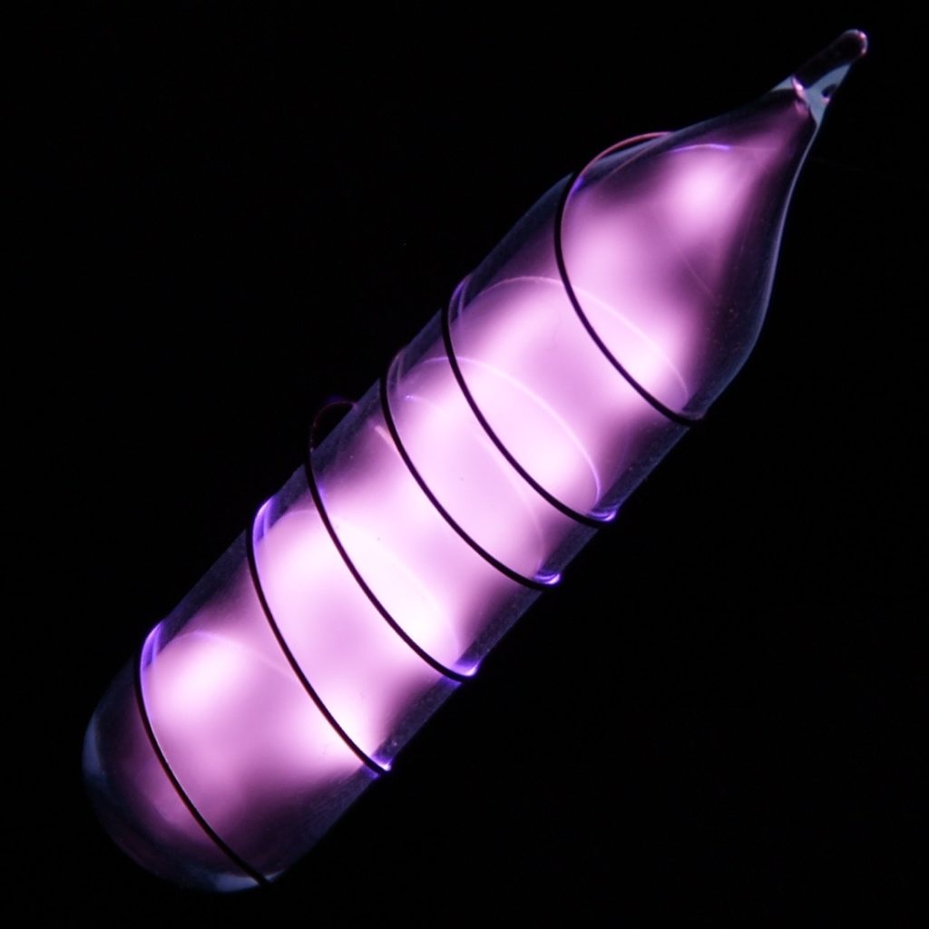 Vial ultrapure helium glowing pale purple