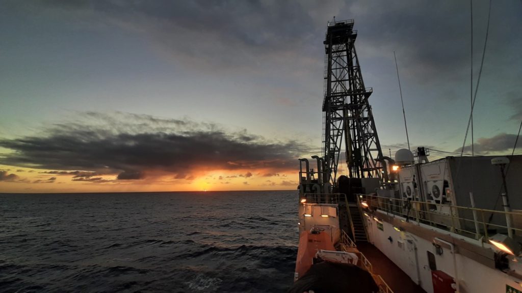 Photo of sunset behind the drilling vessel JOIDES resolution