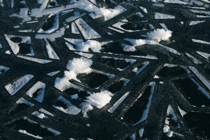 Zooming in on some individual ice crystal aggregates (few centimeters across) and geometric frost patterns on the frozen surface of Eklutna Lake in Southern Alaska. (Credit: Nore Praet via imaggeo.egu.eu)
