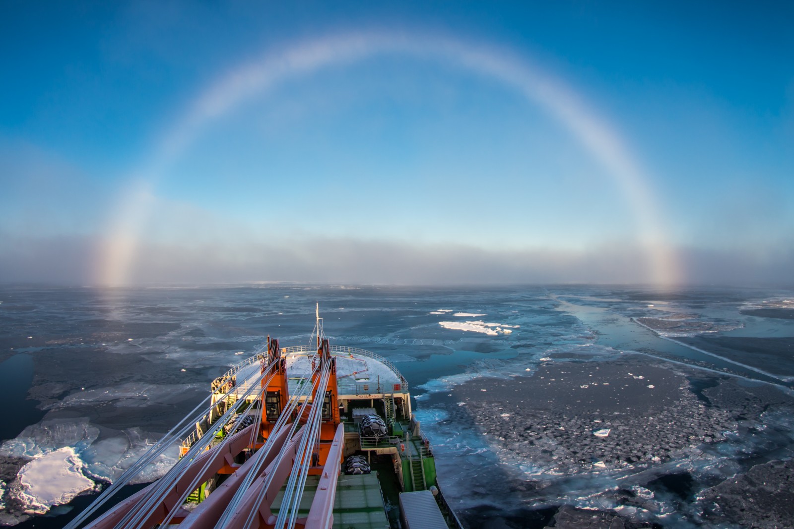 “Above the foggy strip, this white arch was shining, covering one third of the visible sky in the direction of the ship's bow,” he explains. “It was a so-called white, or fog rainbow, which appears on the fog droplets, which are much smaller then rain droplets and cause different optic effects, which is a reason of its white colour.”