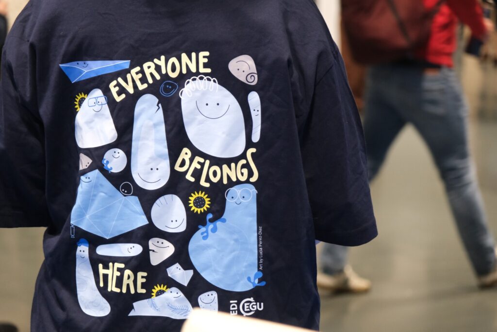The image shows a t-shirt with a colorful design, signifying EDI at EGU.