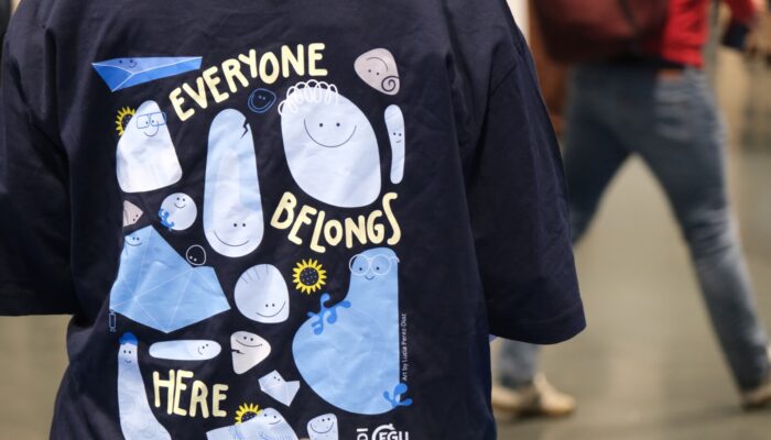 The image shows a t-shirt with a colorful design, signifying EDI at EGU.