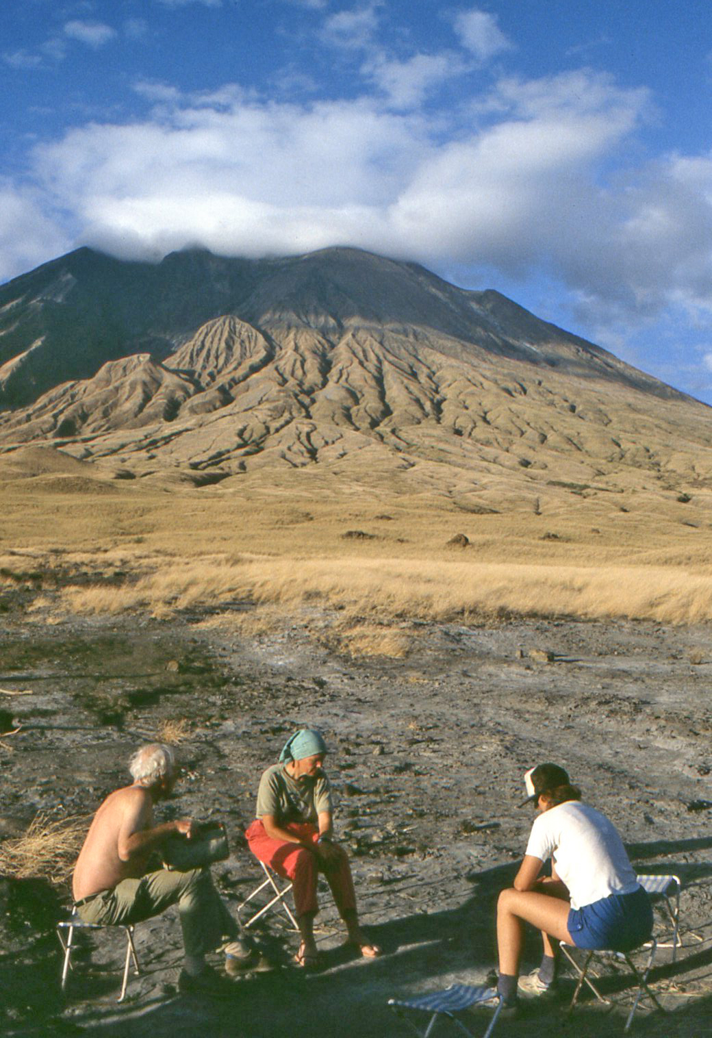 View of Oldoinyo Lengai from base camp, with Barry Dawson, Celia Nyamweru and Gill Norton.