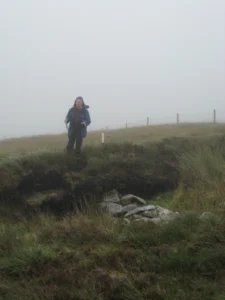 Professor Seamus Caulfield describing an excavated stone wall section in the Céide Fields. Photo: D. Schillereff