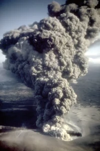Eruption column rising from the east Ukinrek Maar crater in Alaska - Credit: R. Russell/USGS, Wikimedia Commons.