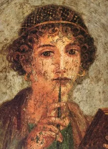 Detail of the portrait of a young woman with writing pen and wax tablets, Museo Archeologico Nazionale di Napoli - Source: Wikimedia Commons.