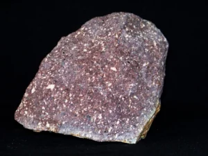 Porphyry, with large crystals visible in a finer surrounding - Source: Piotr Sosnowski, Wikimedia Commons.