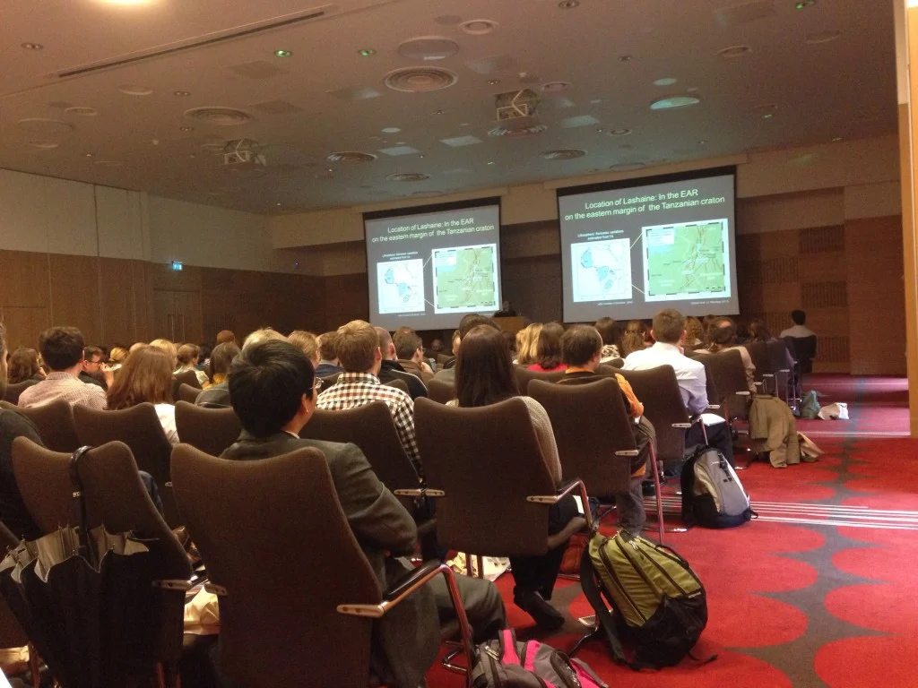The (very welcome) dual-screen layout in the conference room. Preventing neck strain and confusing presenters since 2014. Image credit: James Hickey.