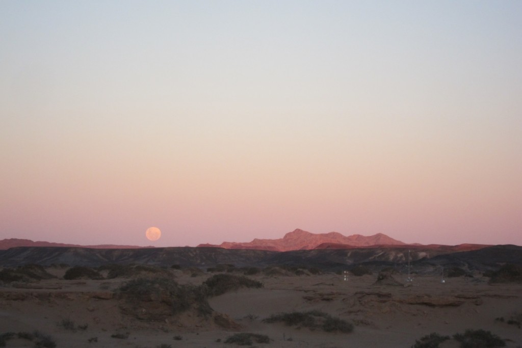 The rising moon over one of the weather stations photographed from the campsite. (Credit: A. Dansie)