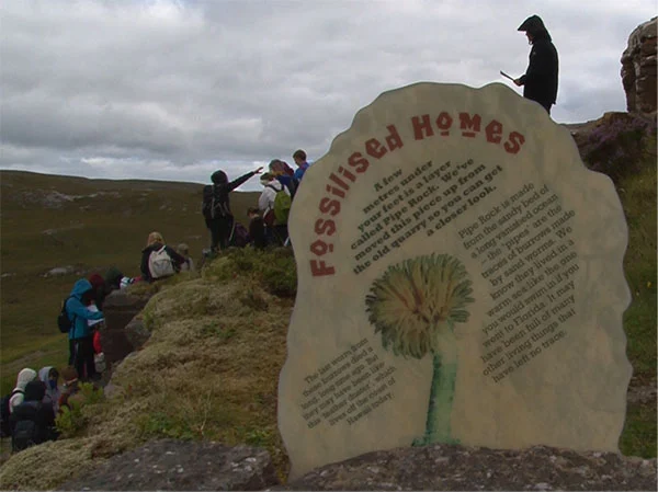 Studying an outcrop in northwest of Scotland. (Credit: Simon Jung)