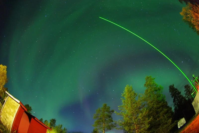 Laser and auroras. (Credit: Matias Takala distributed via imaggeo.egu.eu)