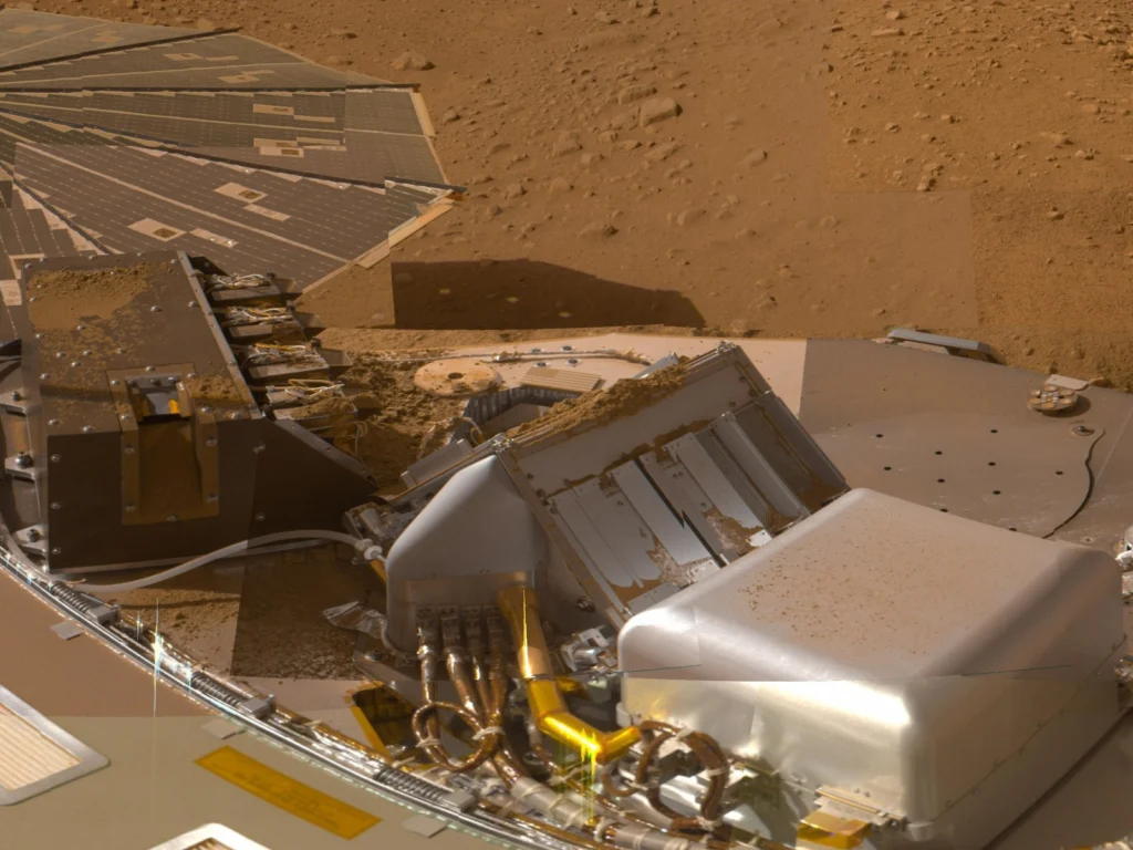 The Phoenix Lander made the first detection of perchlorate on Mars in 2008. Dusty Martian soil can be seen in the background and on the Lander’s frame. Image Credit: NASA/JPL-Caltech/University of Arizona/Texas A&M University.