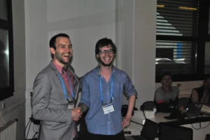 Sam Illingworth (on the left) handing over the batton of the ECS Community over to Wouter at EGU 2014. Image Credit: Roelof Rietbroek, ECS Representative for the EGU Geodesy Division.