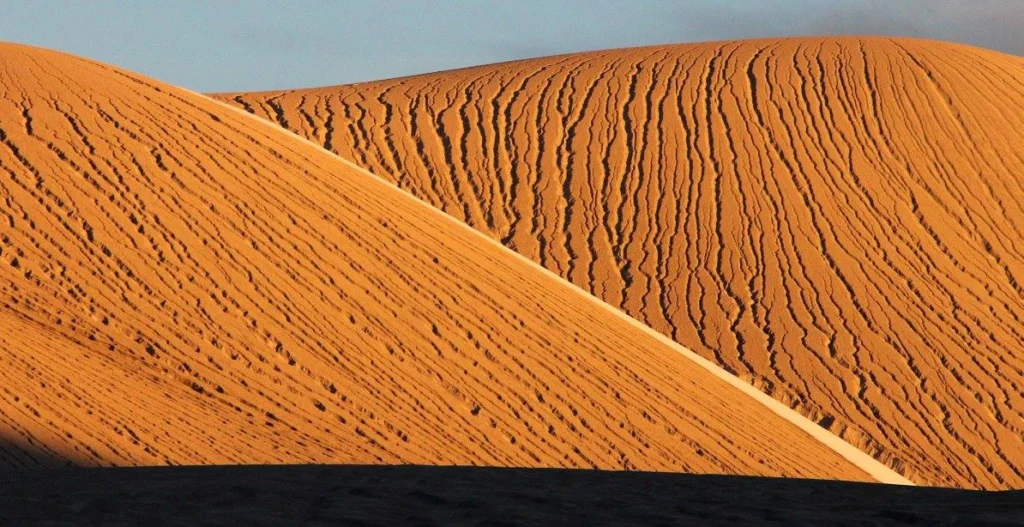 The dunes of the highland plateaus light up in the low sun. Image Credit: Dr. Hugh Tuffen