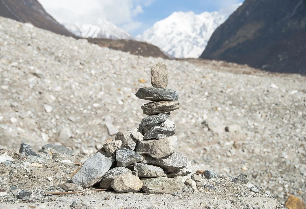 A pile of commemorating stones on the debris that buried Langtang and nearby villages last April, killing and leaving missing nearly 400 people. (Credit: Jane Qiu)