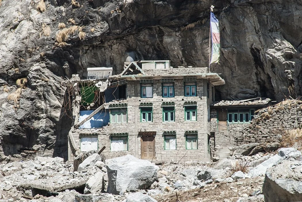 The only building in the village of Langtang that survived the avalanche. The rocky enclave protected it from the crushing debris and the powerful blast. (Credit: Jane Qiu)