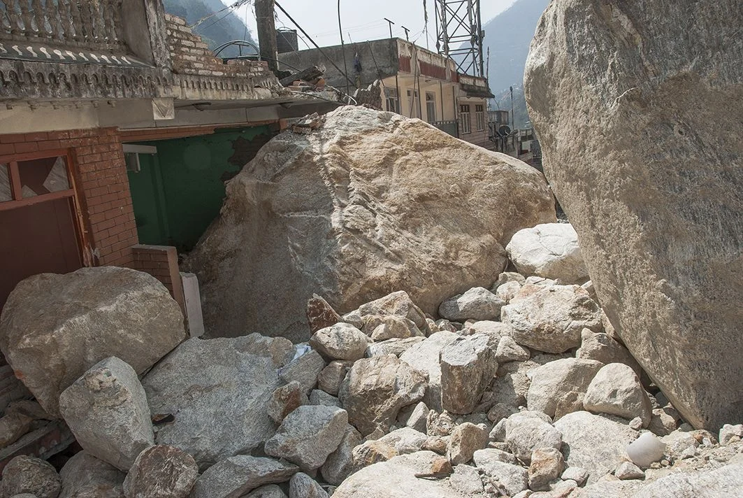 A building in Kodari — which used to be a bustling trade town at the Nepal-Tibet border — was unscathed during the earthquake only to be damaged by large rock falls. (Credit: Jane Qiu)
