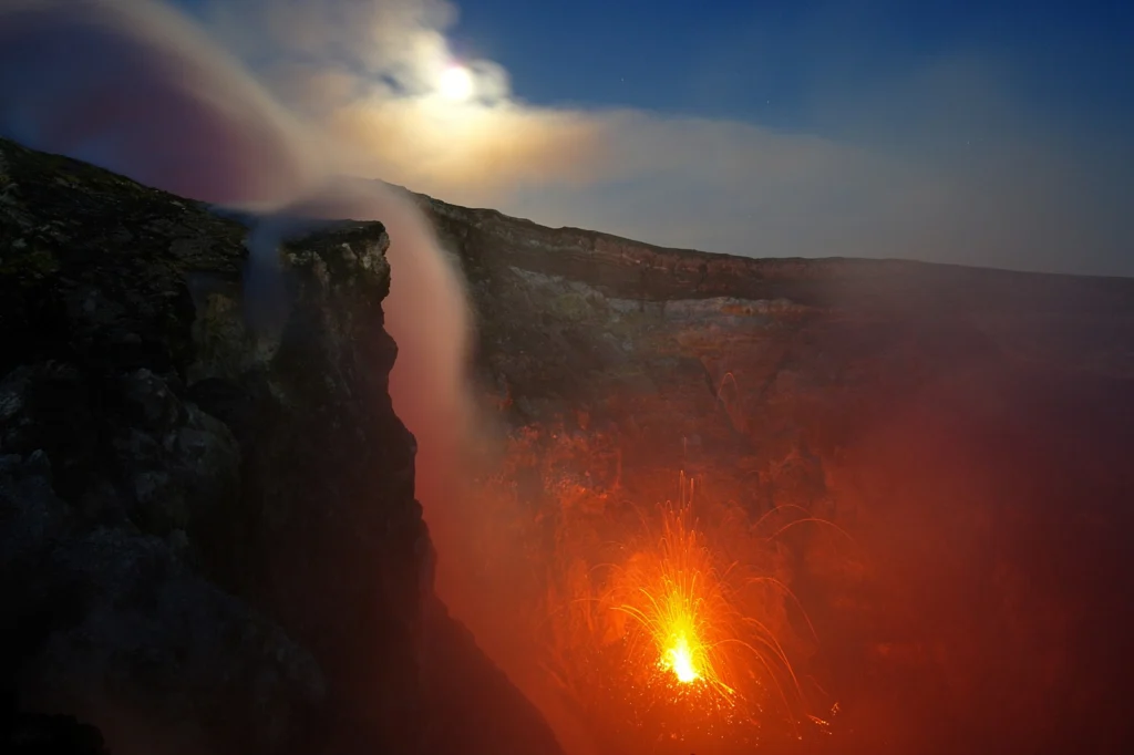  'Full moon over Etna's fire'. Credit: Severine Furst (distributed via imaggeo.egu.eu). Etna is one of the most active volcano on Earth but also one the most monitored. As soon as instruments show any signs of volcanic activity, scientists from the Istituto Nazionale di Geofisica e Vulcanologia (INGV) of Catania urge to the summit to gather various eruption data. In this summer evening, the fresh wind sweep the clouds to reveal the rise of the full moon over one of Etna's summit craters where a strombolian eruption is taking place. 
