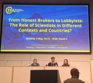 The image shows speakers at the Great Debate 1 during EGU26. From left to right: Lene Topp, Nicole Arbour and Linda Lammensalo. Lorenzo Melchor Fernandéz and Alessandro Allegra were presenting online. 