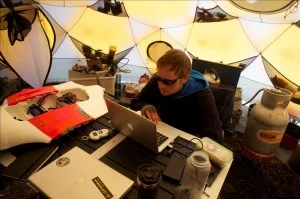 Inside the mess tent. Downloading the GPS, attitude and the locations of the camera triggers from the flight controller.
