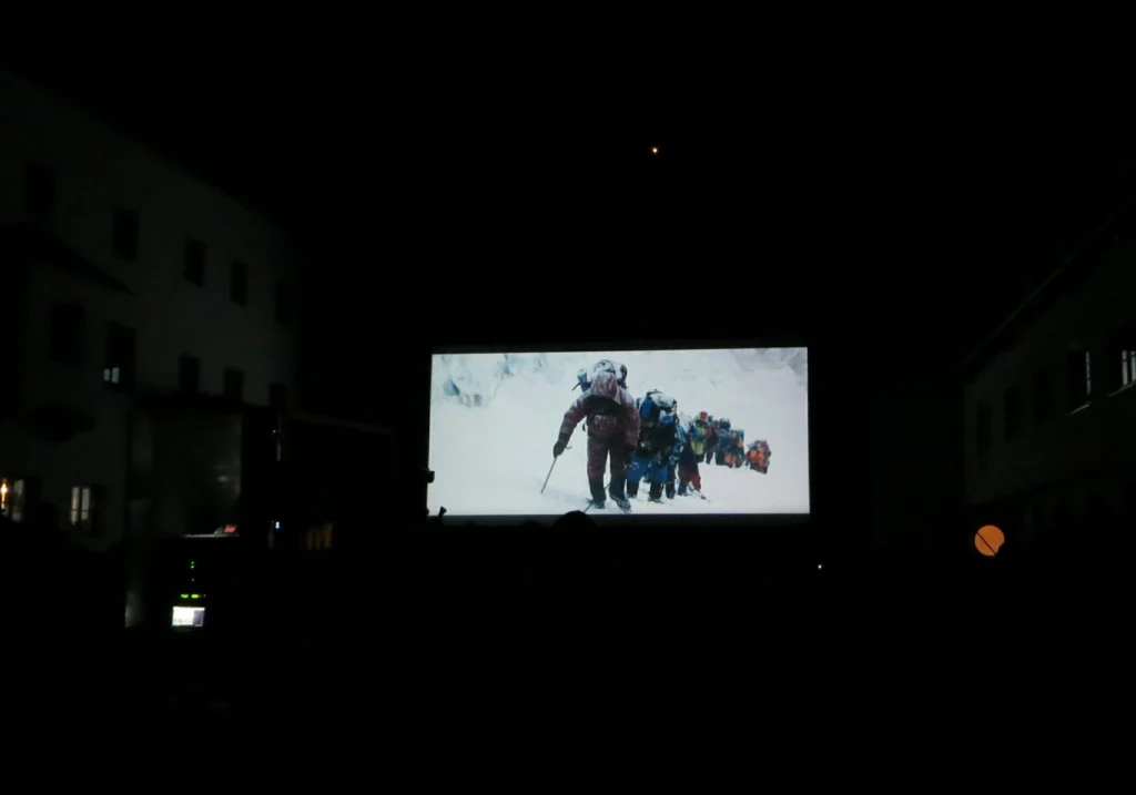 Outdoor screening of Everest in the village square. (Credit: I. Nias)