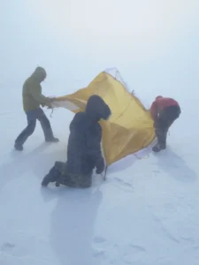 Setting the last tent – the latrine tent – at Dye-2 on the 20th of May. Credit: Babis Charalampidis.