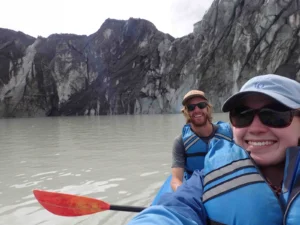 Greta Wells and Jonathan Burton conducting a bathymetric survey on Imja Lake [Credit: G. Wells]