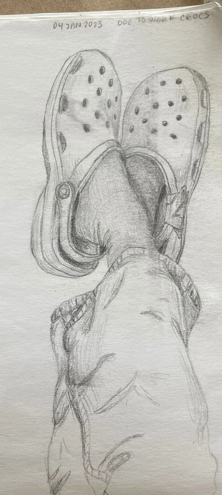 Pencil painting of legs and crocs on called "Ode to work Crocs"