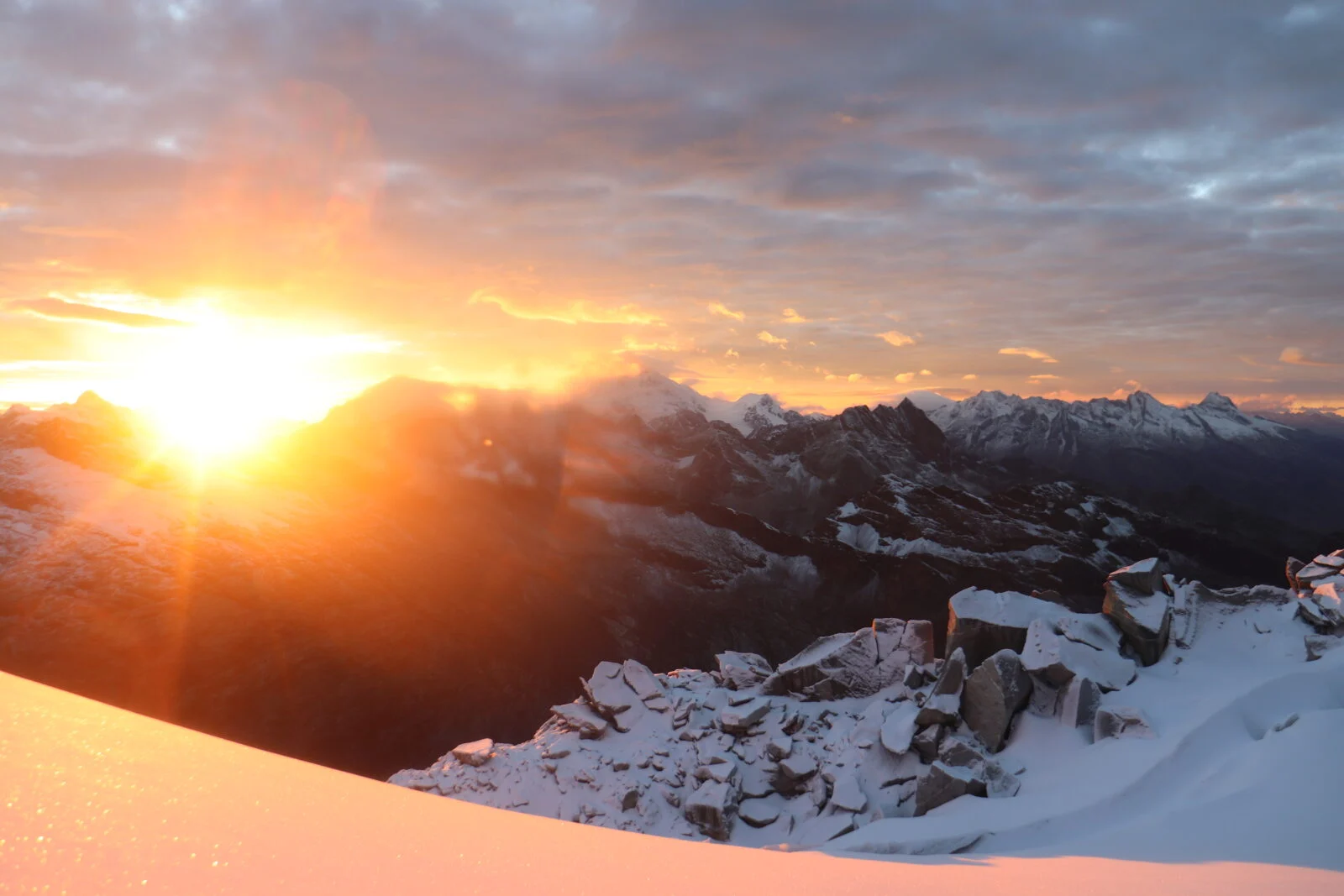 Figure 5: (Left) Sampling at the summit of the Vallunaraju Glacier. (Right) Sunrise view in the Cordillera Blanca. 