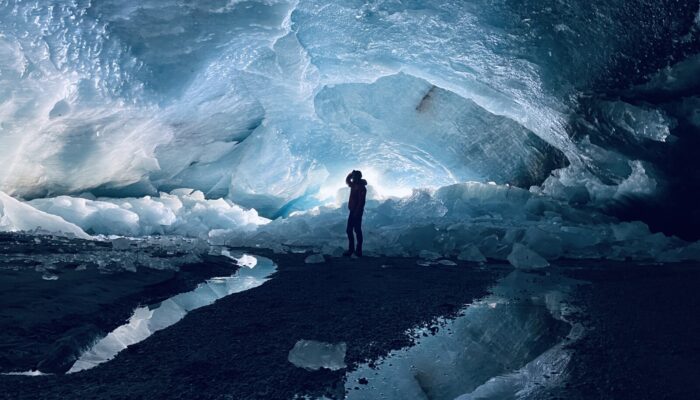Peak glacier extinction in the mid-twenty-first century