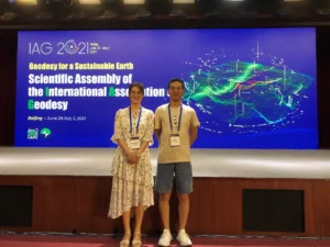 Zhen Li and his colleague Qianqian Li at the IAG scientific assembly in Beijing.