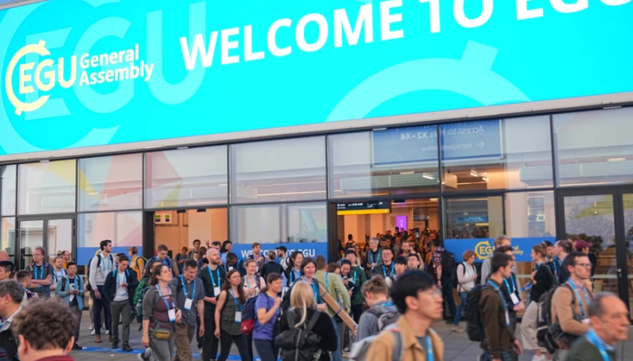 The entrance to the EGU General Assembly from a previous year. A banner over the entrance doorways reads "Welcome to EGU".