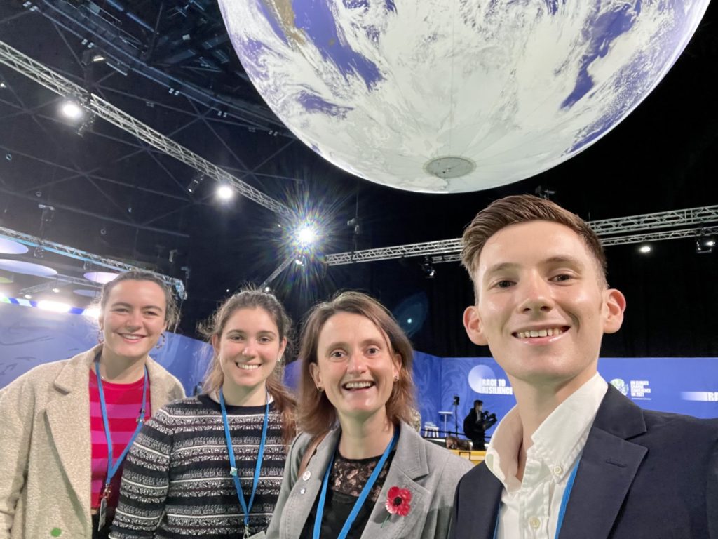 Photo of myself with the globe in the global action hub