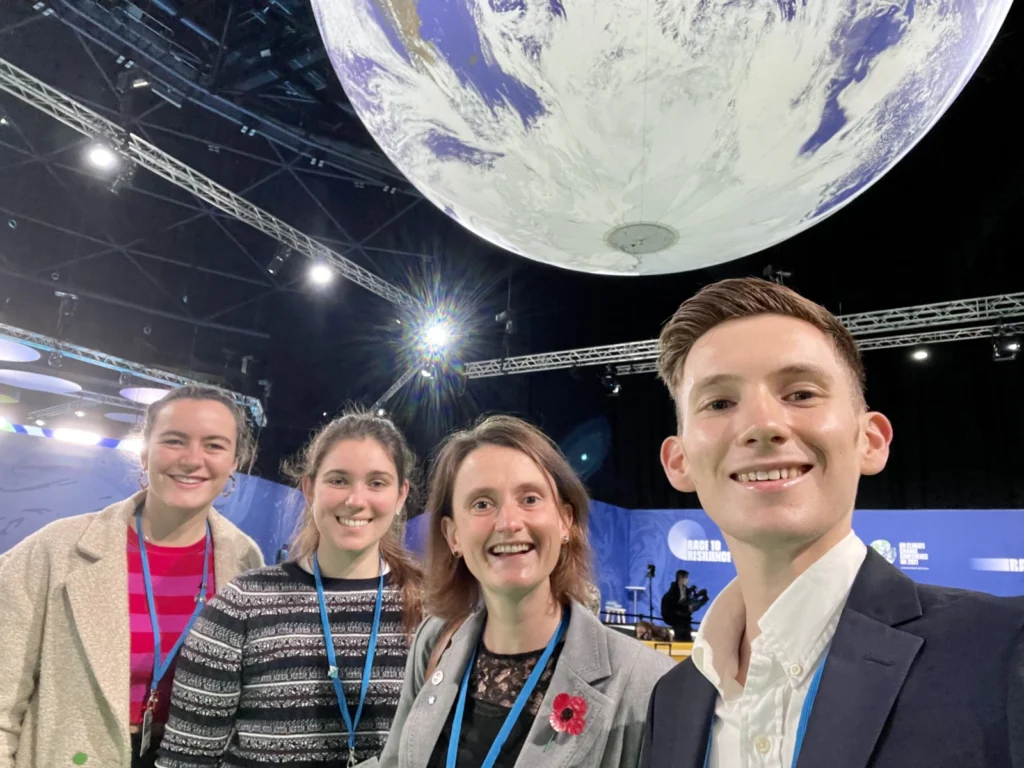 Photo of myself with the globe in the global action hub